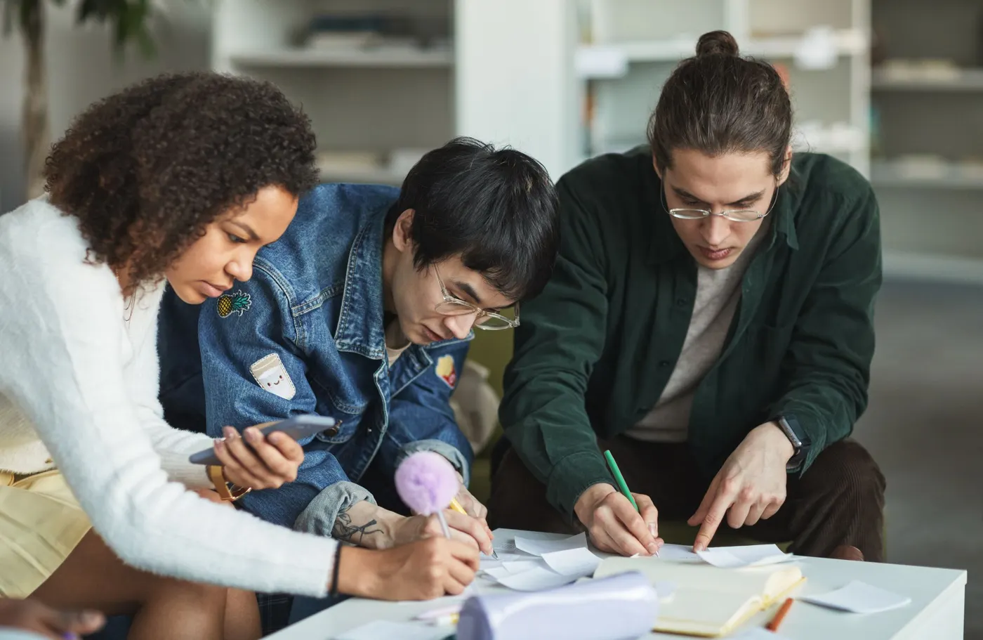 Diverse group of students studying together around a table